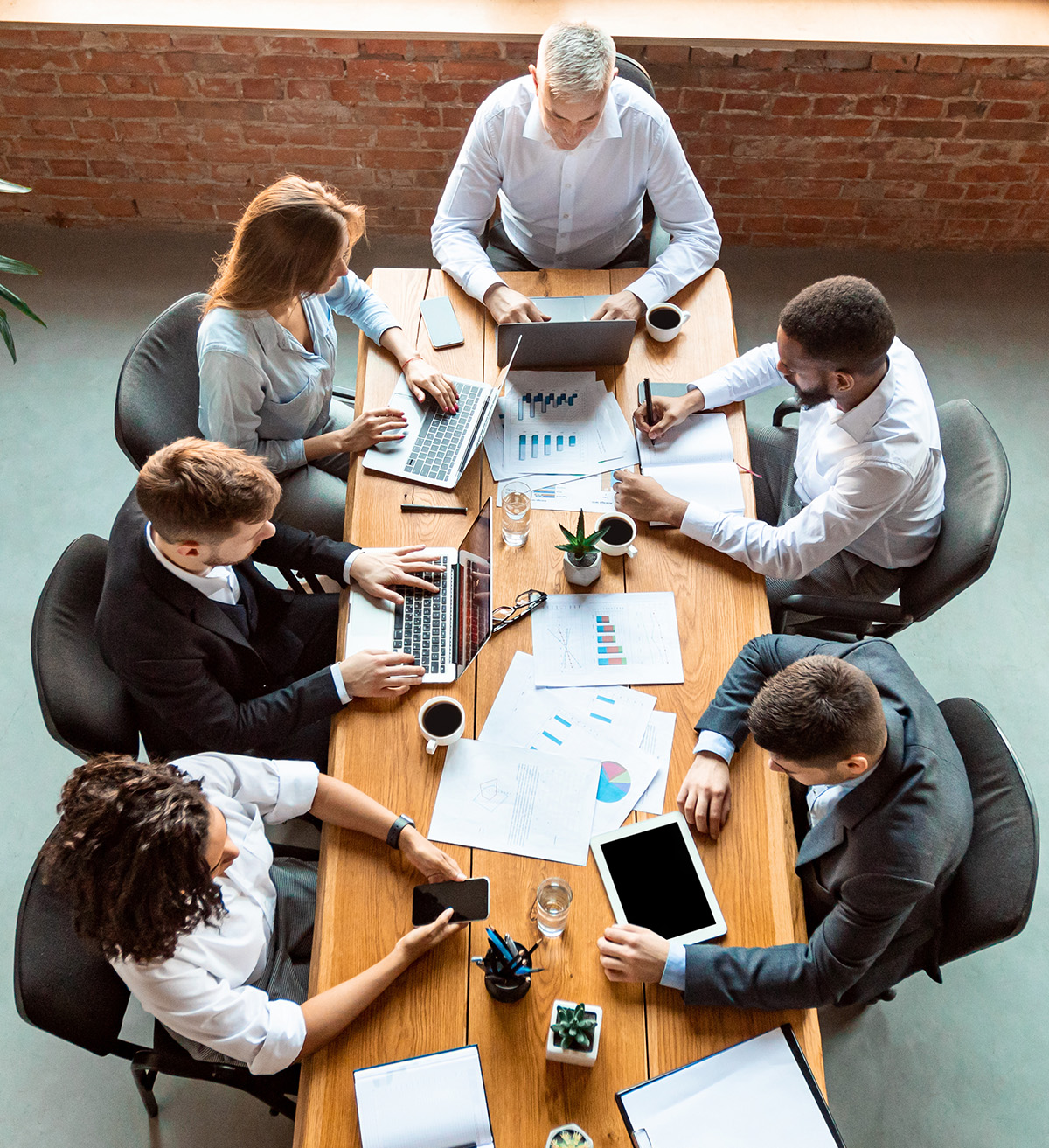 bank-page-bbh-meeting Diverse Coworkers Working Using Computers Sitting At Desk In Office